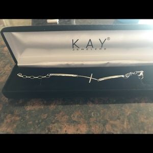 Kay’s cross bracelet